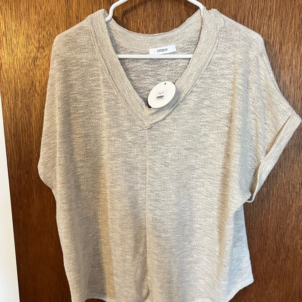 Light sand color top.